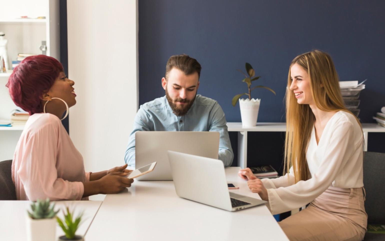 Professional setting up dedicated learning workspace with financial documents and analysis tools